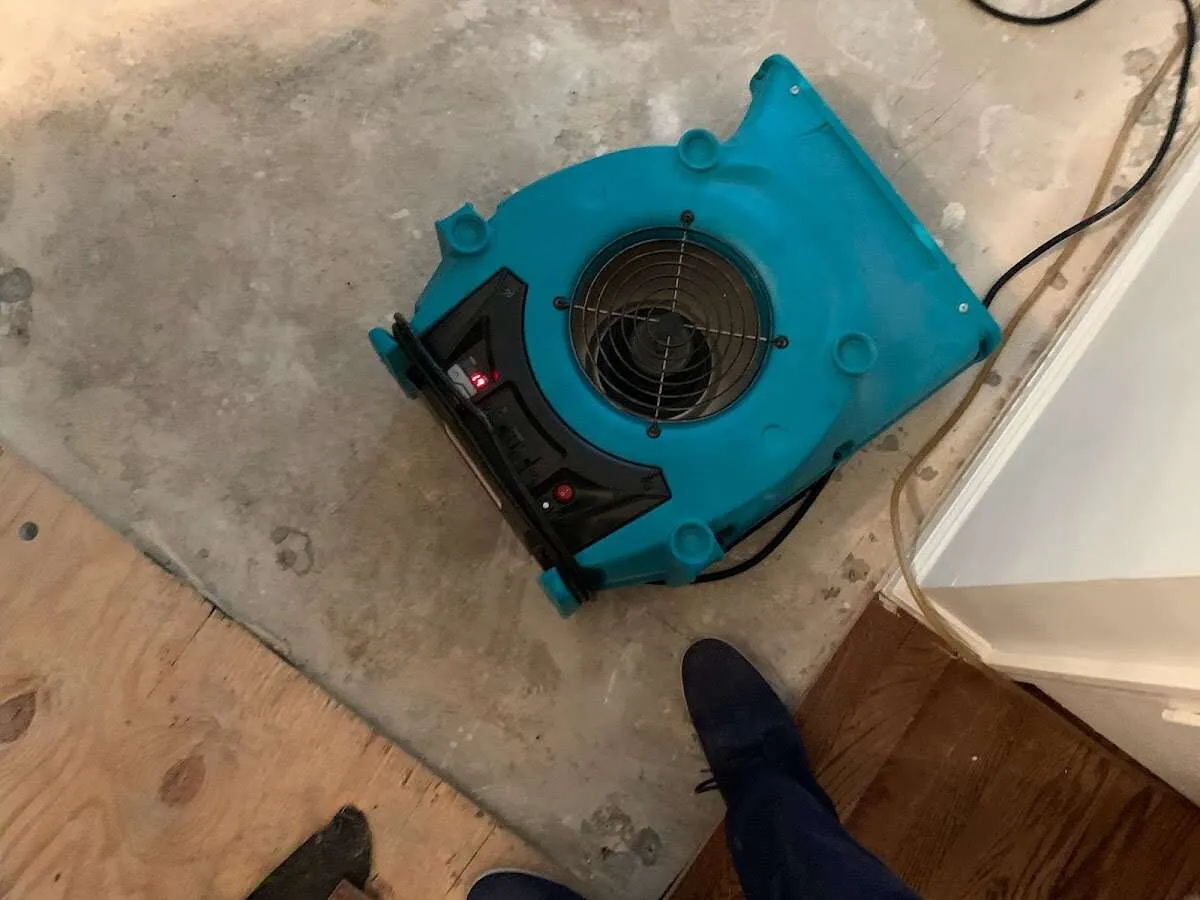 Air mover drying subfloor during Leak Detection & Repair in Shelby
