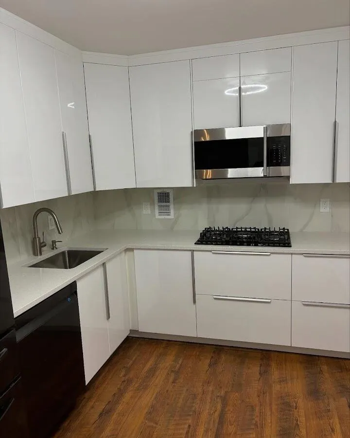 Restored kitchen with white cabinets after water damage in Shelby